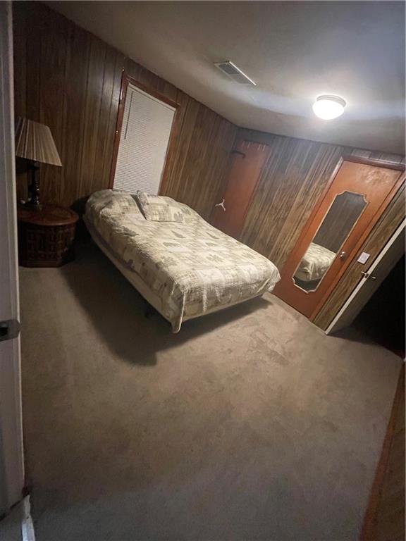 71 McGuire Road Dallas, GA 30157 - Photo 15 of 15 a bedroom with a bed and a night stand