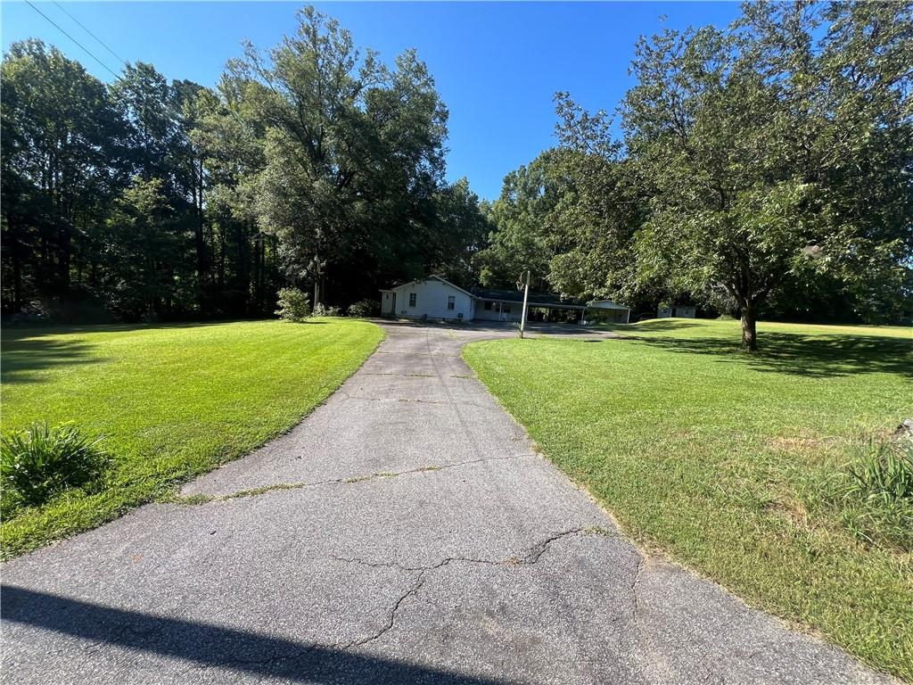 71 McGuire Road Dallas, GA 30157 - Photo 3 of 15 a view of a park with trees in the background