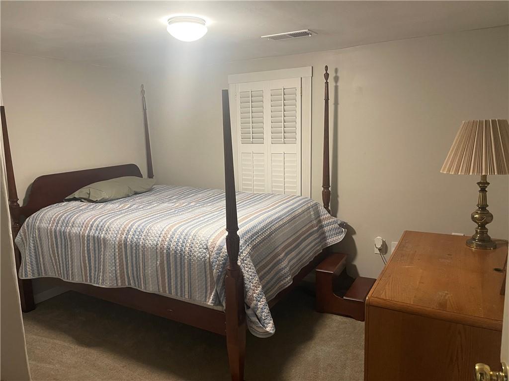 71 McGuire Road Dallas, GA 30157 - Photo 10 of 15 a bedroom with a bed and a window