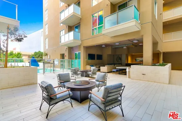 a outdoor space with patio furniture and a potted plant