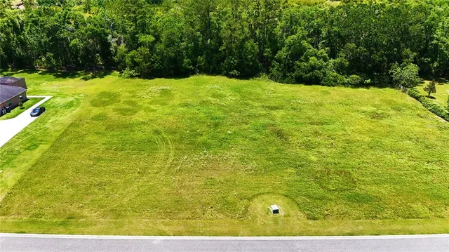 a view of yard with patio