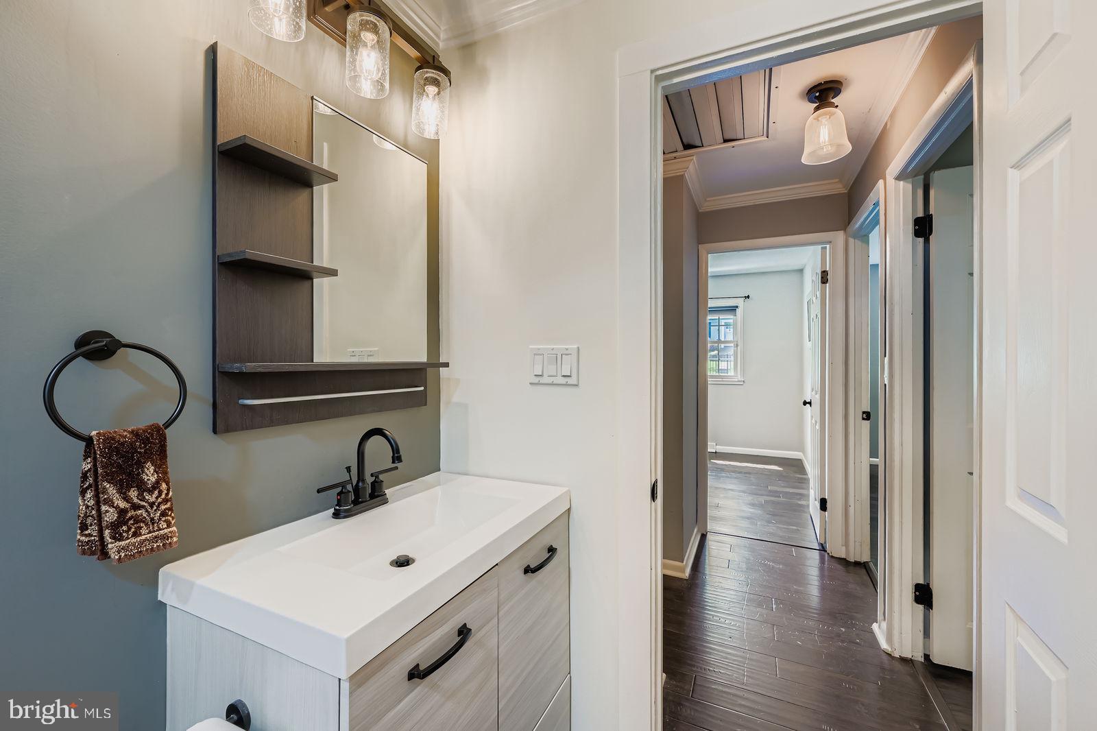 6205 Ridgeview Avenue Baltimore, MD 21206 - Photo 16 of 34 a bathroom with a sink and a mirror