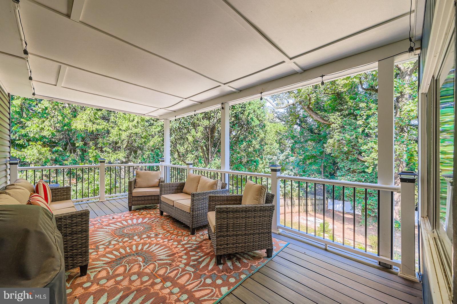 6205 Ridgeview Avenue Baltimore, MD 21206 - Photo 20 of 34 a balcony with furniture and wooden floor