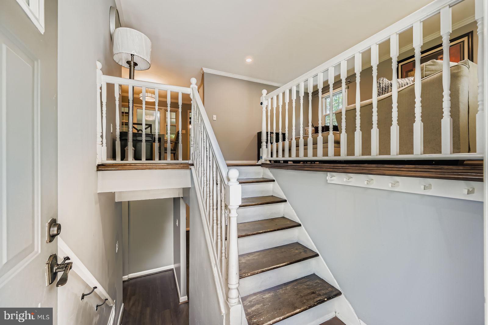 6205 Ridgeview Avenue Baltimore, MD 21206 - Photo 2 of 34 a view of staircase with white walls and a window