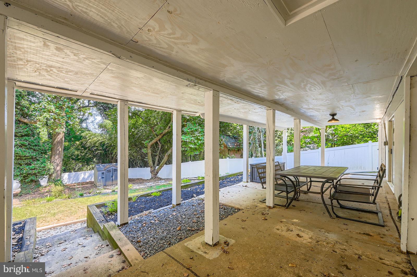 6205 Ridgeview Avenue Baltimore, MD 21206 - Photo 21 of 34 a view of a porch with chairs and backyard