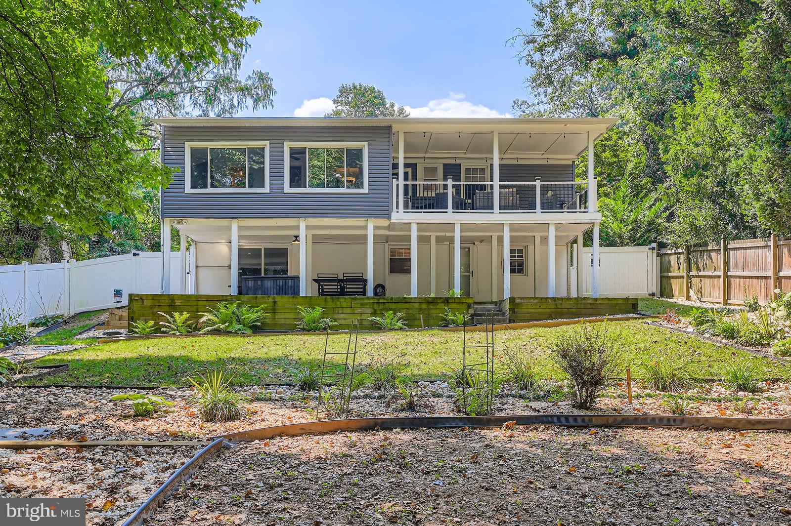 6205 Ridgeview Avenue Baltimore, MD 21206 - Photo 22 of 34 a front view of a house with a yard
