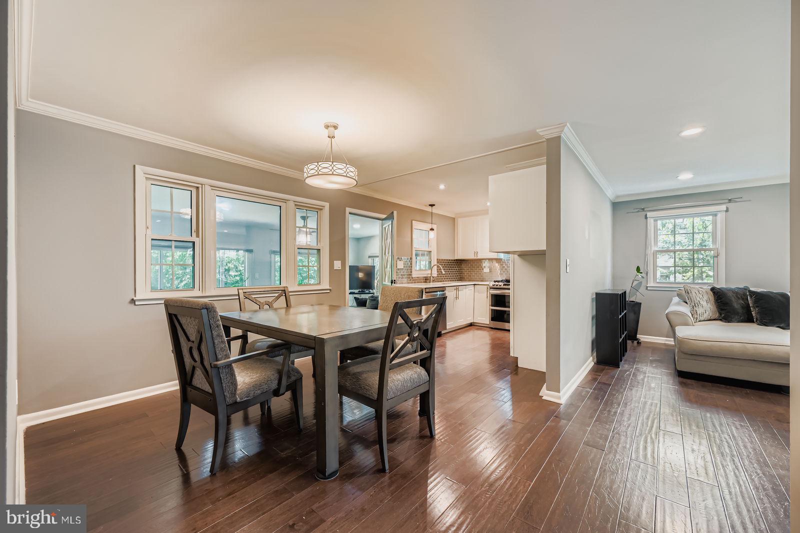 6205 Ridgeview Avenue Baltimore, MD 21206 - Photo 7 of 34 a view of a dining room with furniture and wooden floor