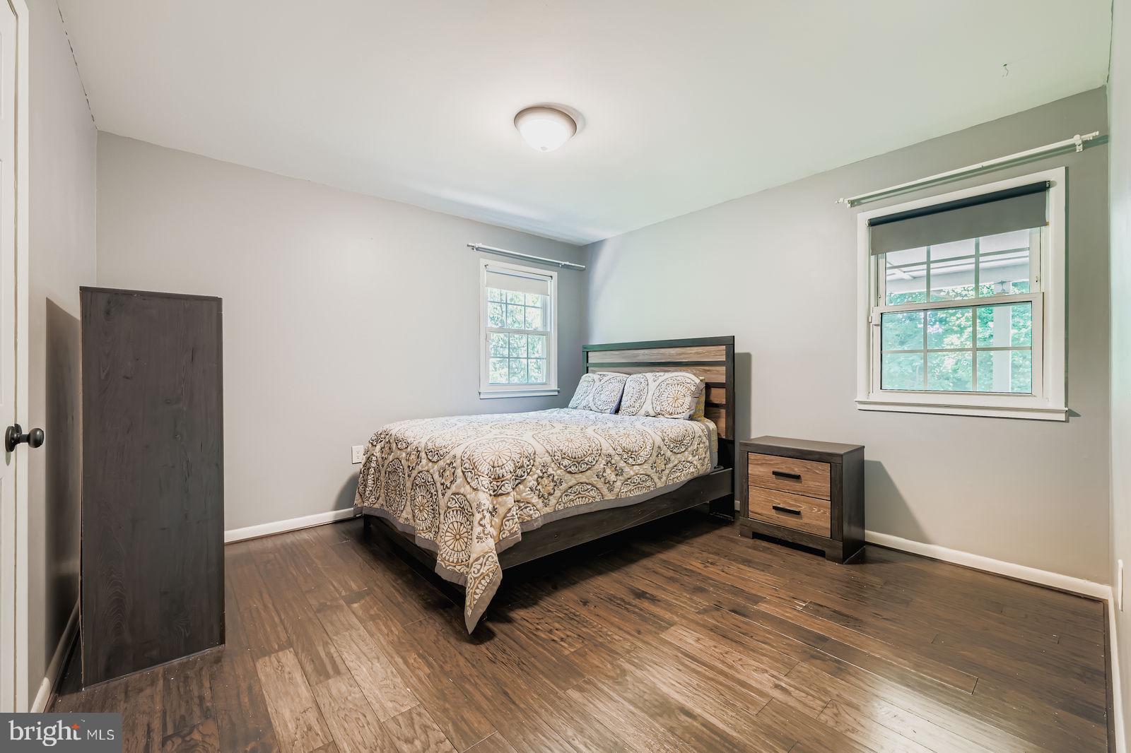 6205 Ridgeview Avenue Baltimore, MD 21206 - Photo 10 of 34 a bedroom with a bed and wooden floor