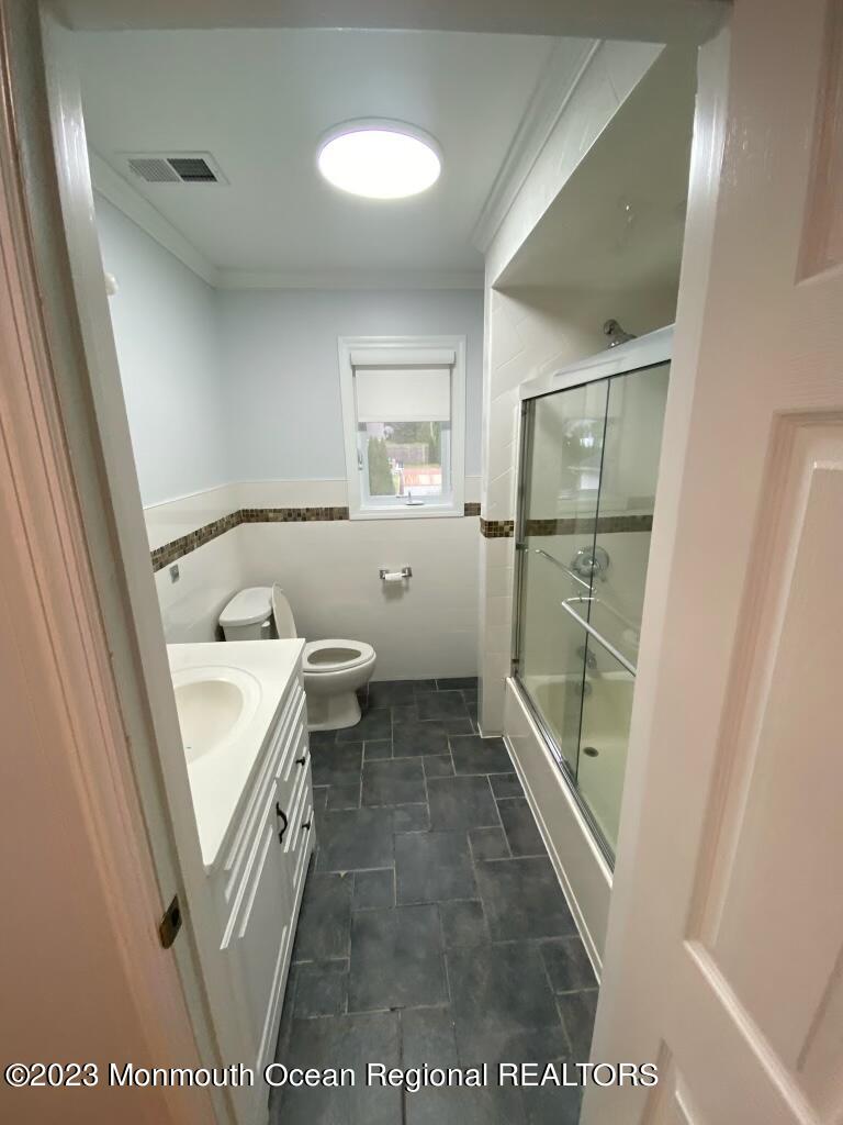 259 Norgrove Avenue Long Branch, NJ 07740 - Photo 6 of 11 a bathroom with a sink a toilet and a shower