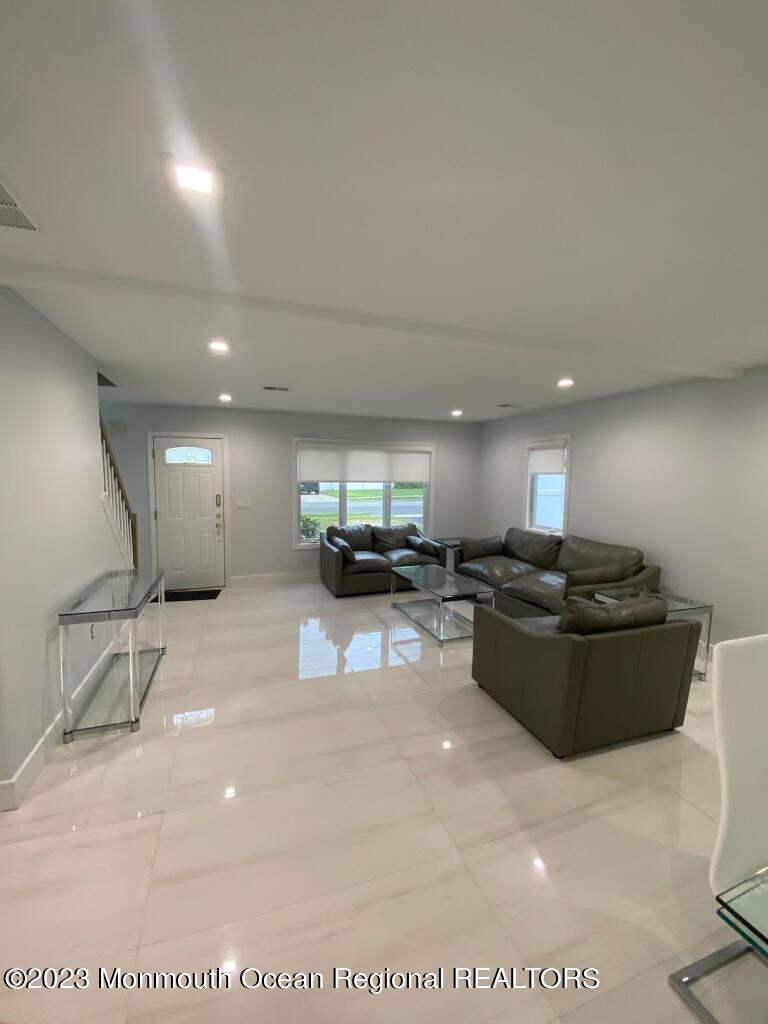 259 Norgrove Avenue Long Branch, NJ 07740 - Photo 8 of 11 a living room with furniture and a gym