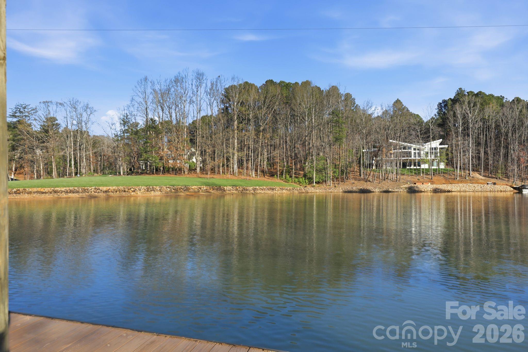 232 Apache Road Troutman, NC 28166 - Photo 3 of 25 a view of lake with green space