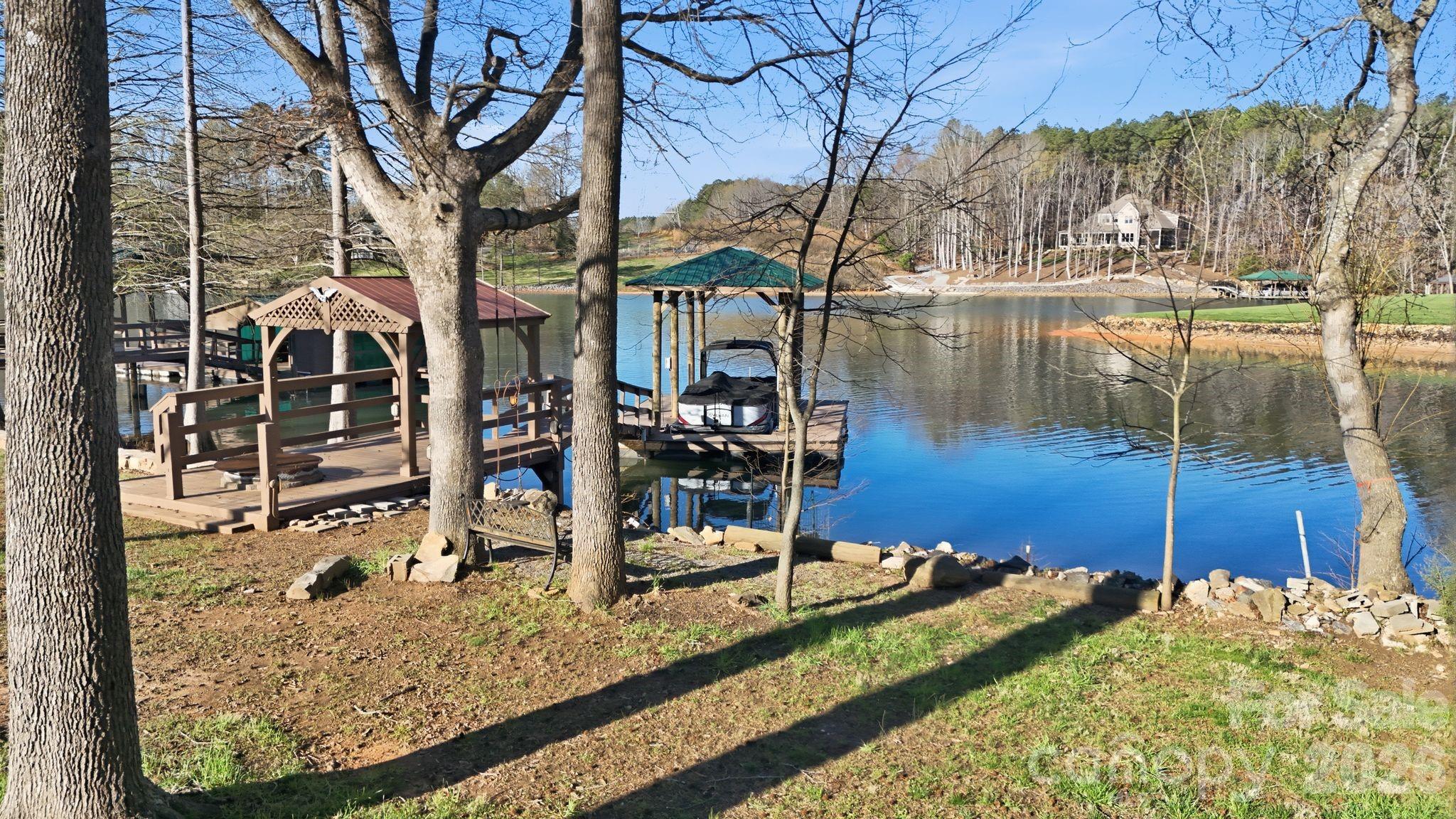 232 Apache Road Troutman, NC 28166 - Photo 4 of 25 a view of a lake with a house