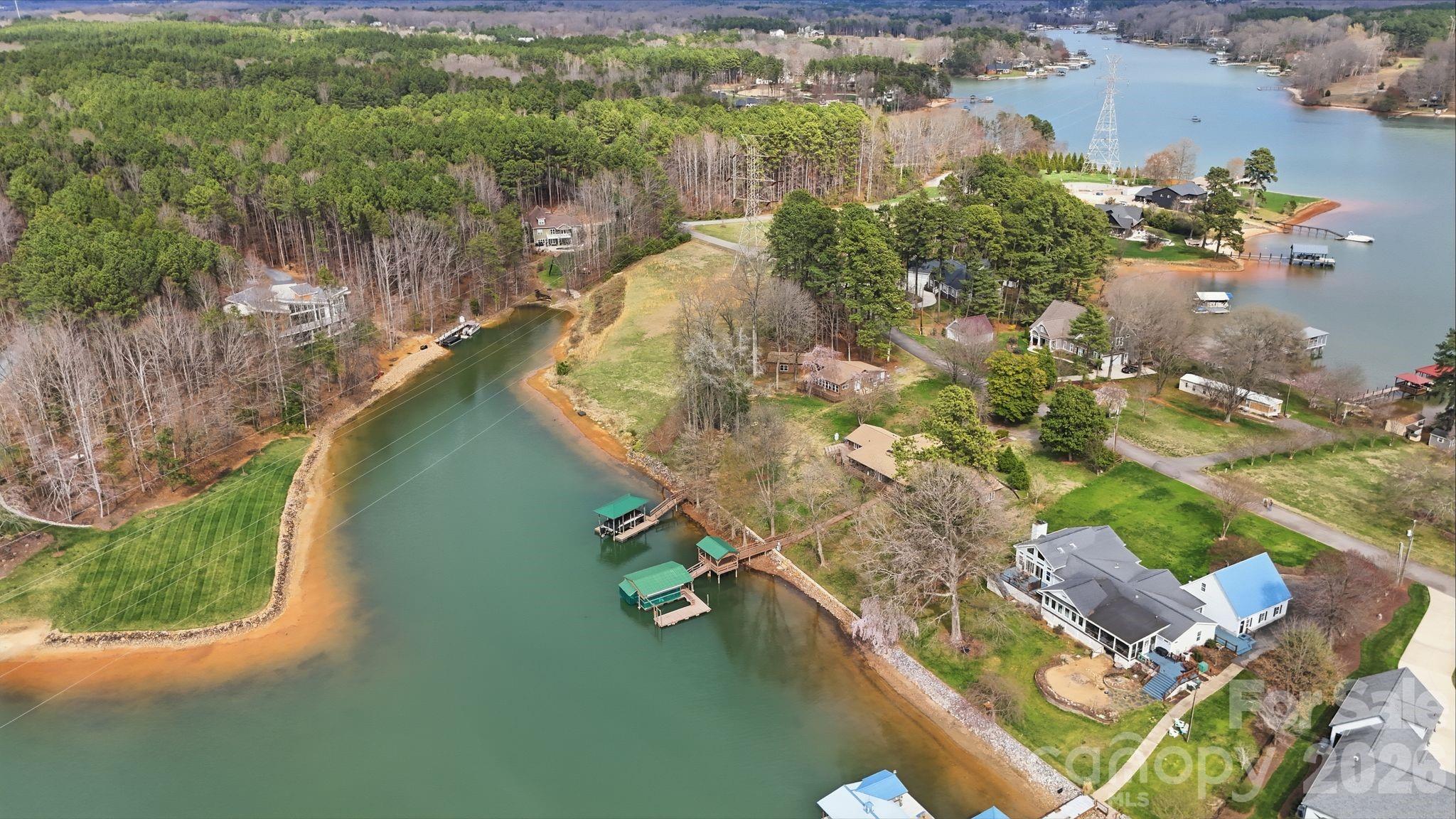 232 Apache Road Troutman, NC 28166 - Photo 6 of 25 a view of a lake with a yard
