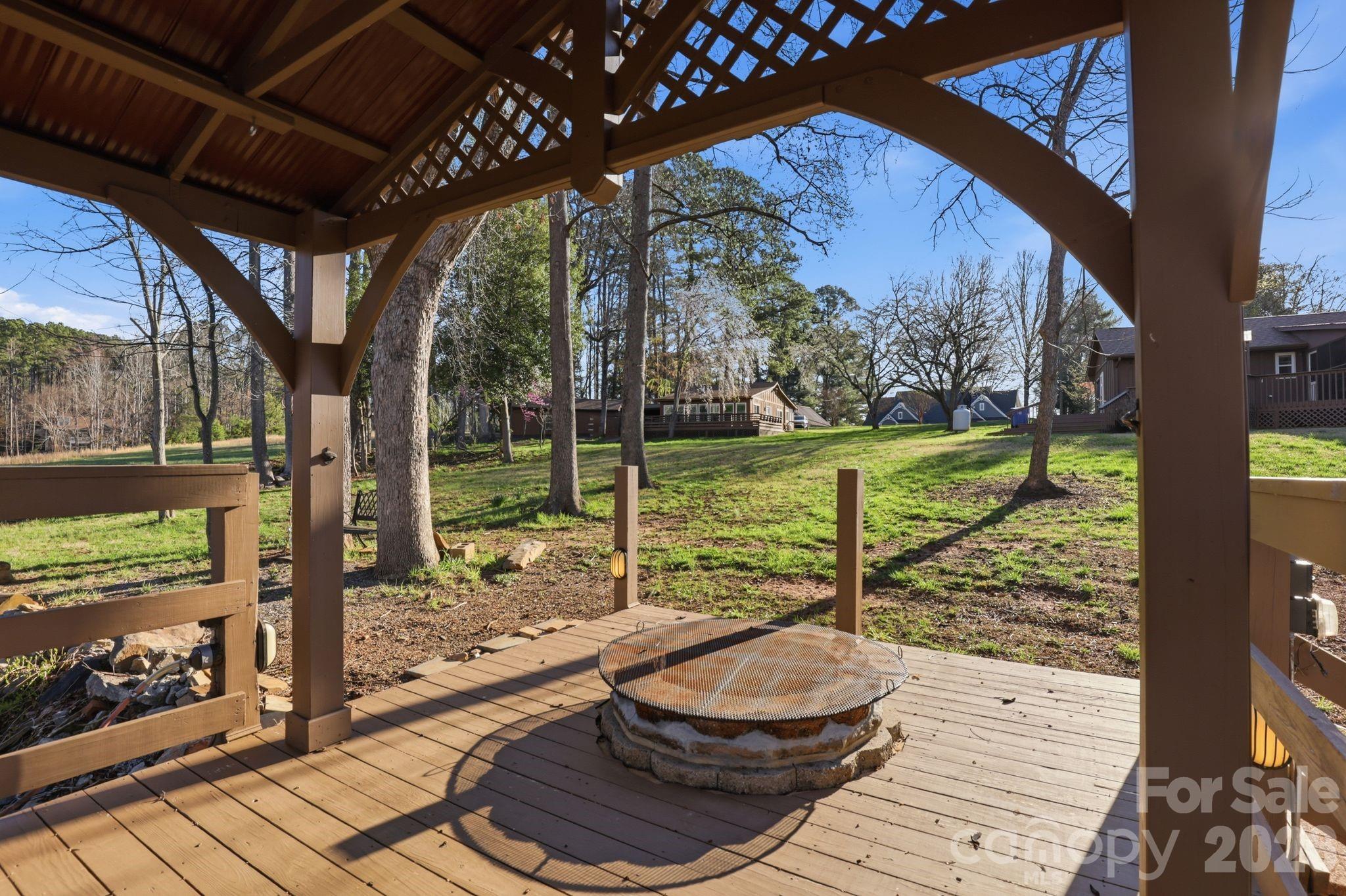 232 Apache Road Troutman, NC 28166 - Photo 7 of 25 a view of a porch with furniture and garden