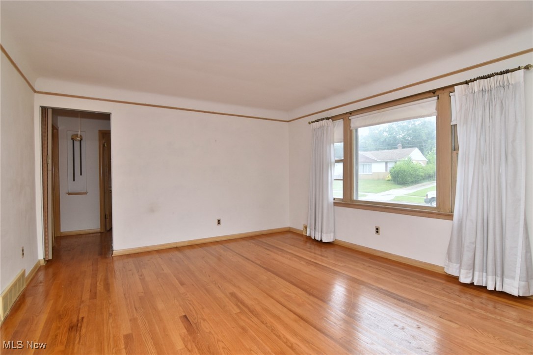 9421 David Road Cleveland, OH 44125 - Photo 9 of 36 Unfurnished room featuring light wood finished floors