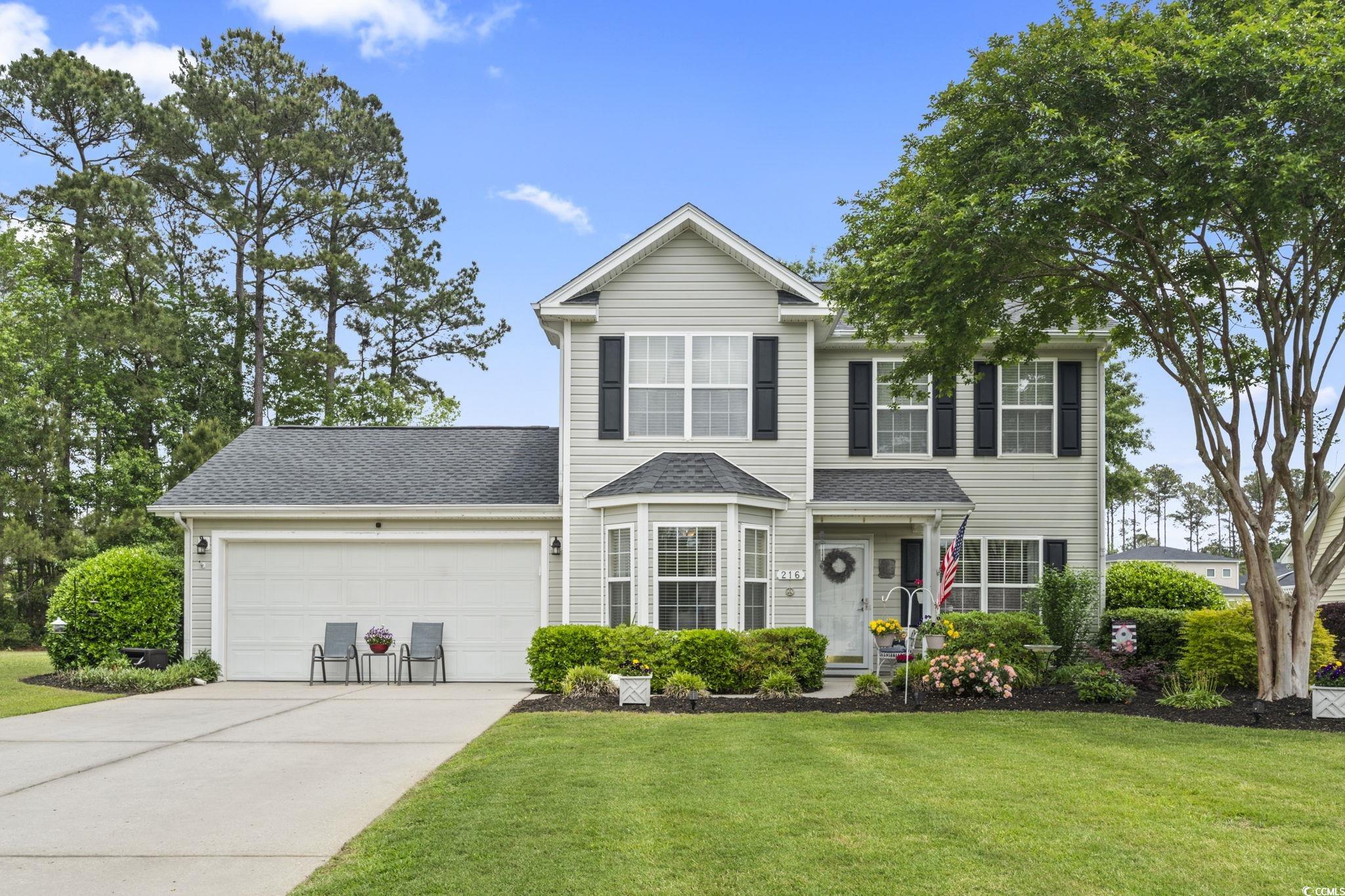 216 Whitchurch Street Murrells Inlet, SC 29576 - Photo 1 of 40 Traditional-style house featuring a garage, a shin