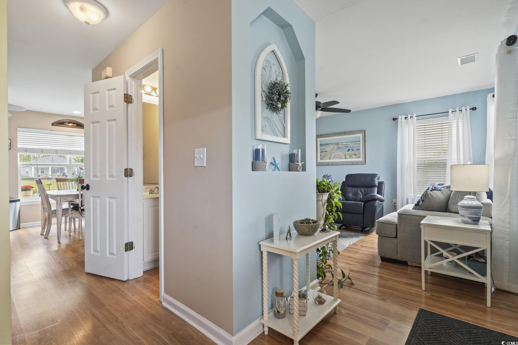 216 Whitchurch Street Murrells Inlet, SC 29576 - Photo 23 of 40 Hall with baseboards, wood finished floors, and vi