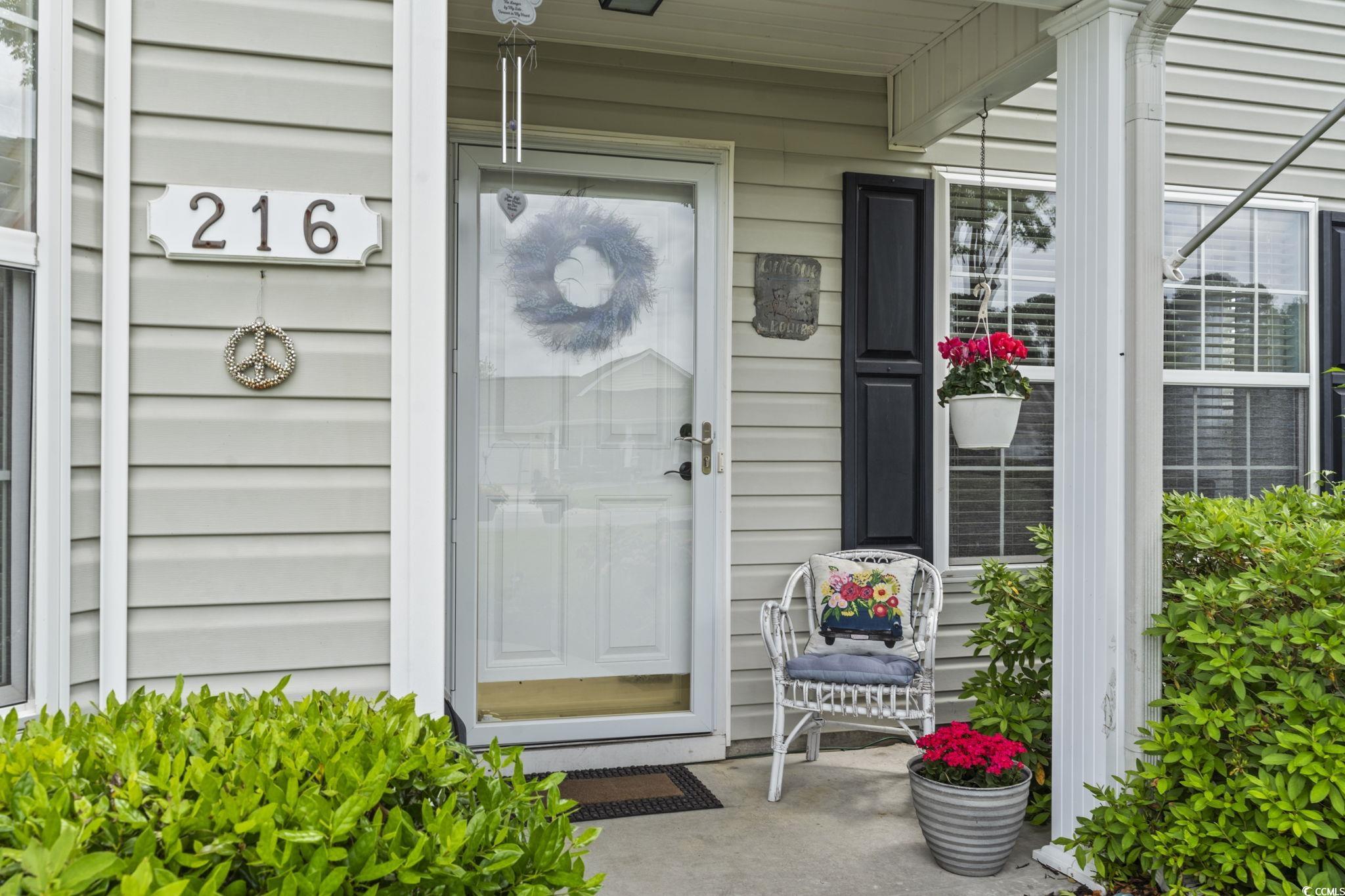 Entrance to property featuring a porch