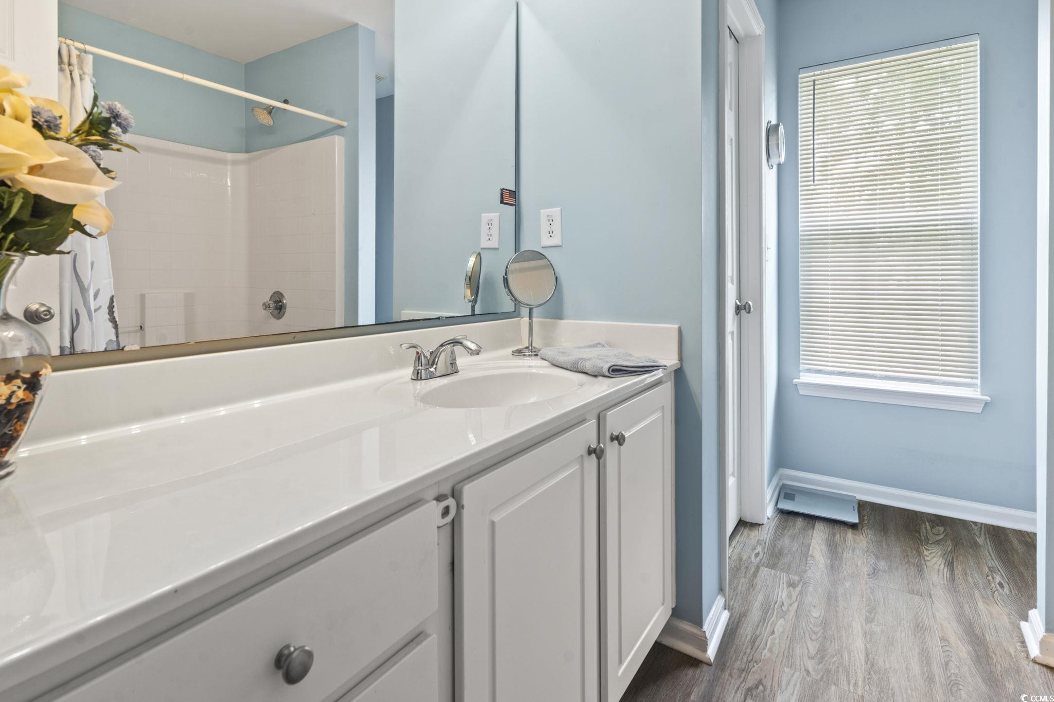 216 Whitchurch Street Murrells Inlet, SC 29576 - Photo 31 of 40 Bathroom featuring a shower, baseboards, wood fini