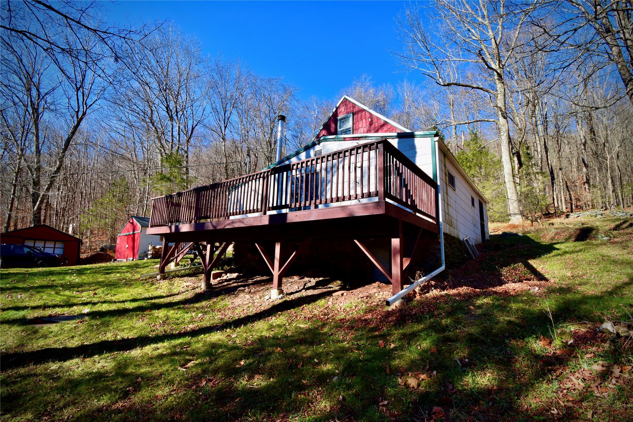 339 Mountain Lake Road Andes, NY 13731 - Photo 14 of 36 Rear view of house featuring a lawn, a shed, and a deck