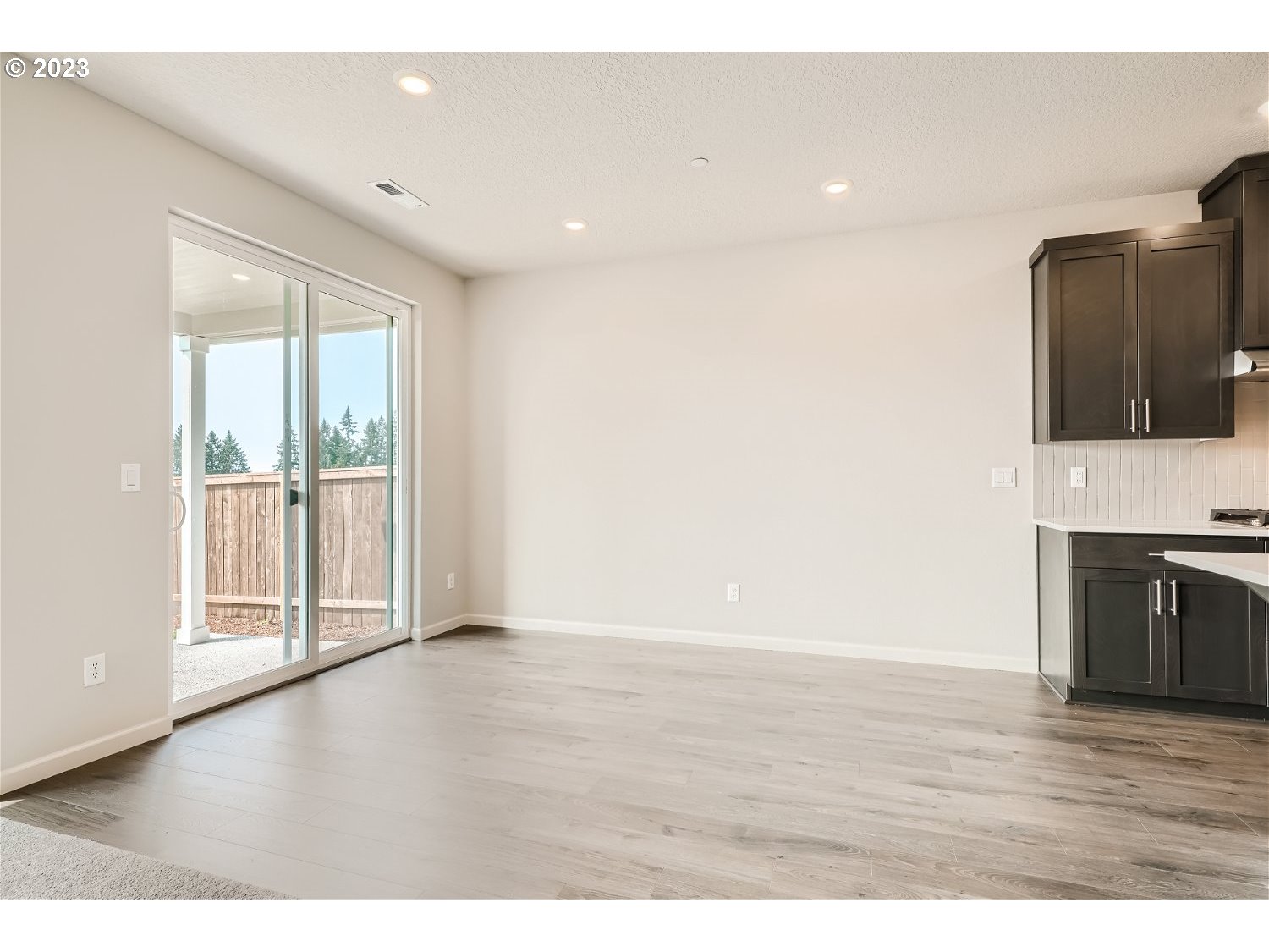 2816 South 7th Circle Ridgefield, WA 98642 - Photo 16 of 25 a view of an empty room with wooden floor and a window