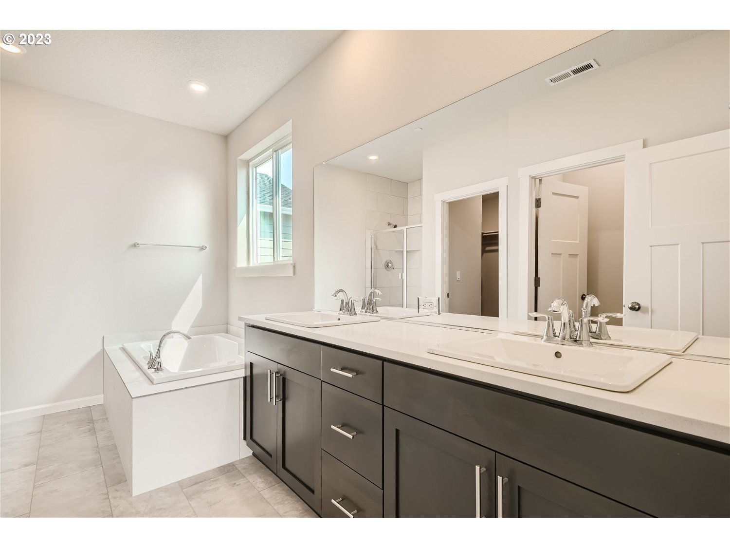 2816 South 7th Circle Ridgefield, WA 98642 - Photo 19 of 25 a bathroom with a sink double vanity granite and a mirror