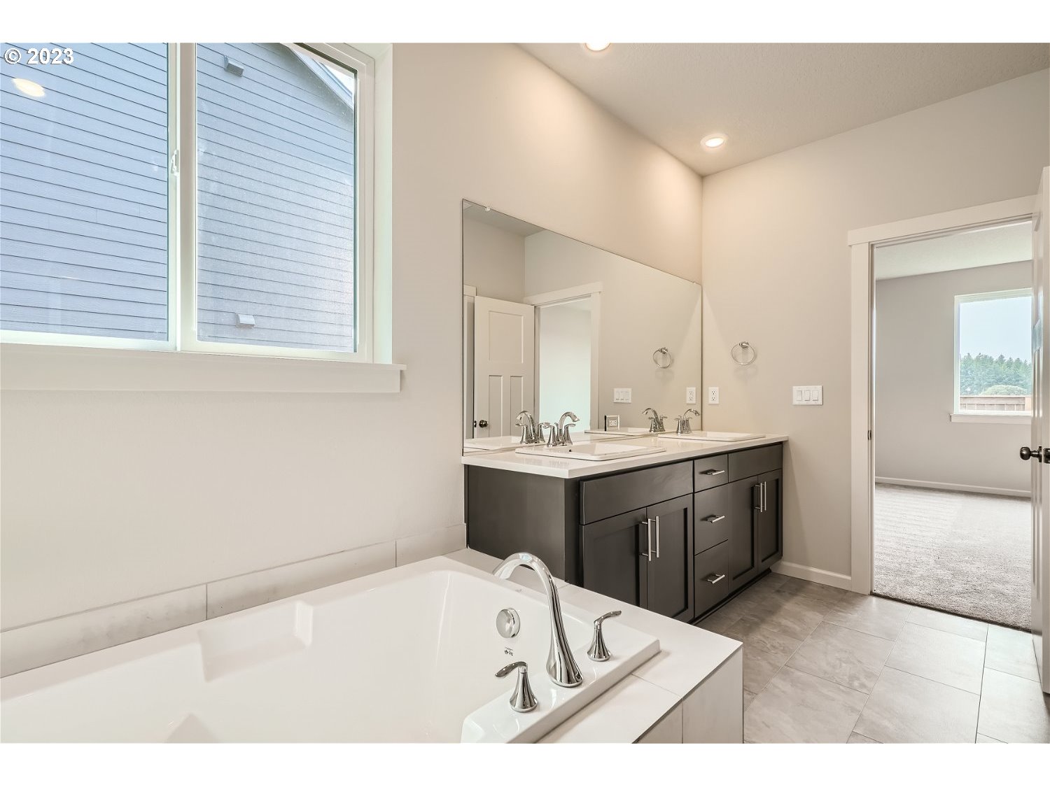 2816 South 7th Circle Ridgefield, WA 98642 - Photo 20 of 25 a bathroom with a tub sink and mirror
