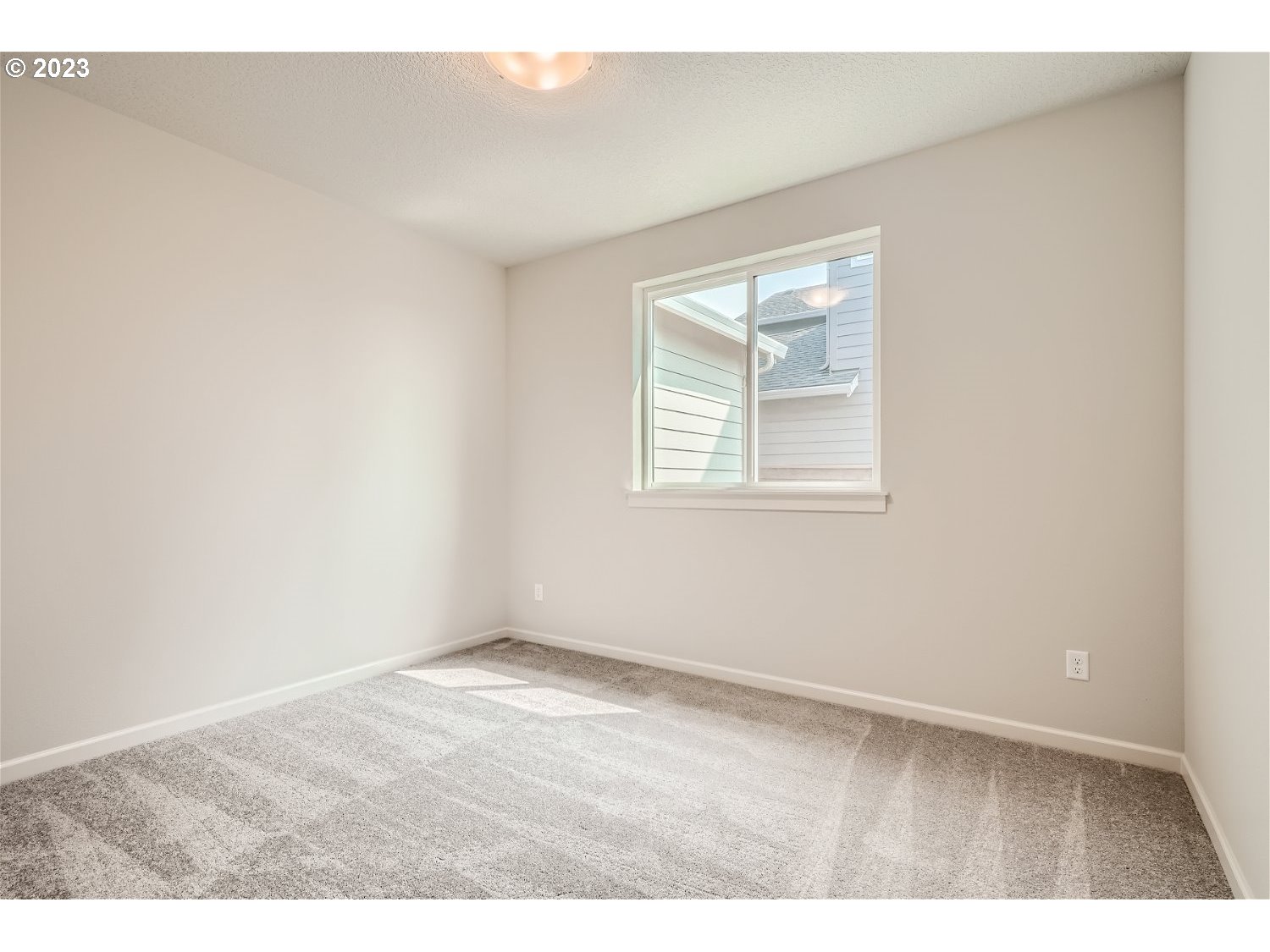 2816 South 7th Circle Ridgefield, WA 98642 - Photo 22 of 25 an empty room with wooden floor and windows