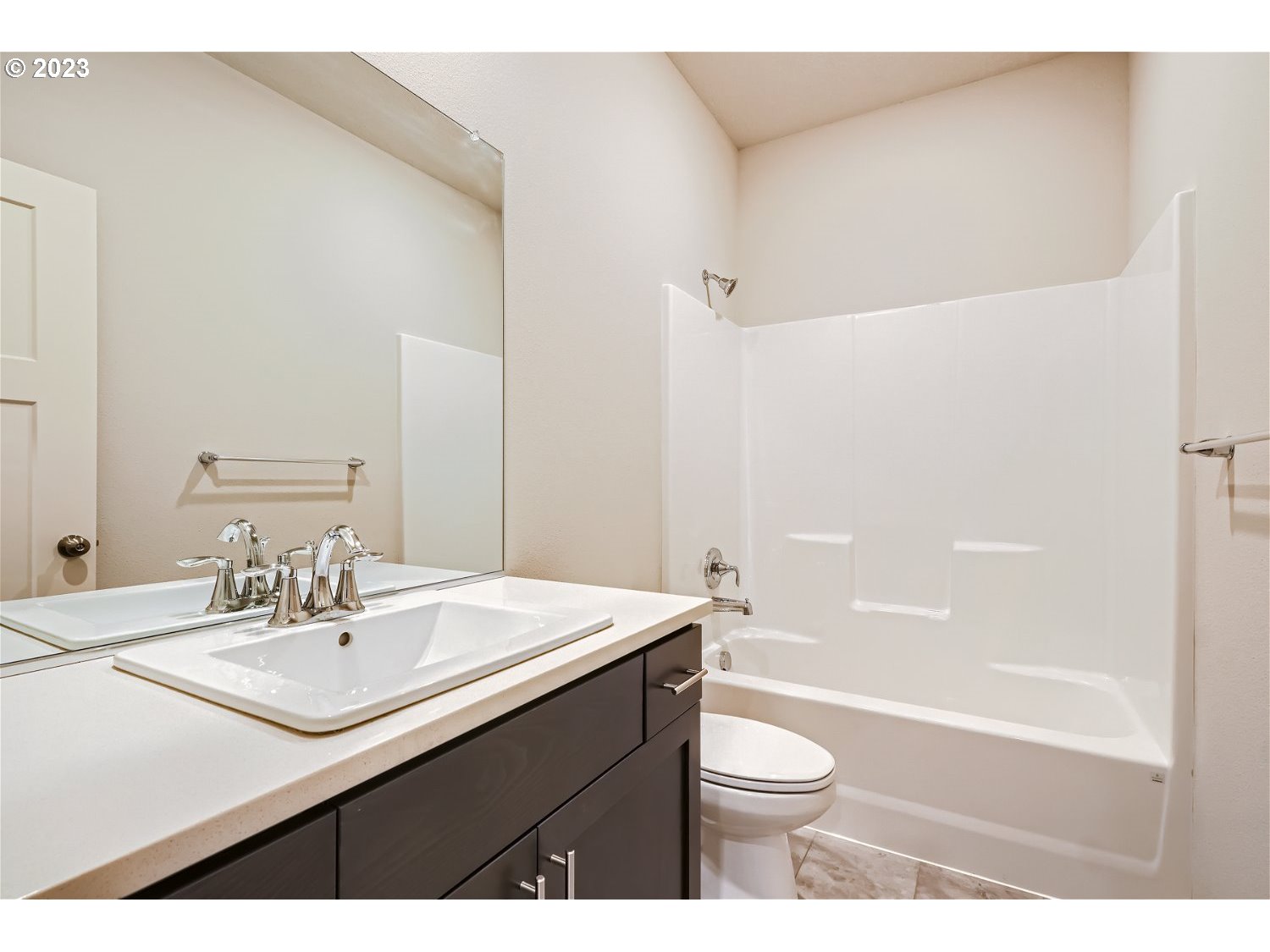 2816 South 7th Circle Ridgefield, WA 98642 - Photo 23 of 25 a bathroom with a sink a toilet a mirror and shower