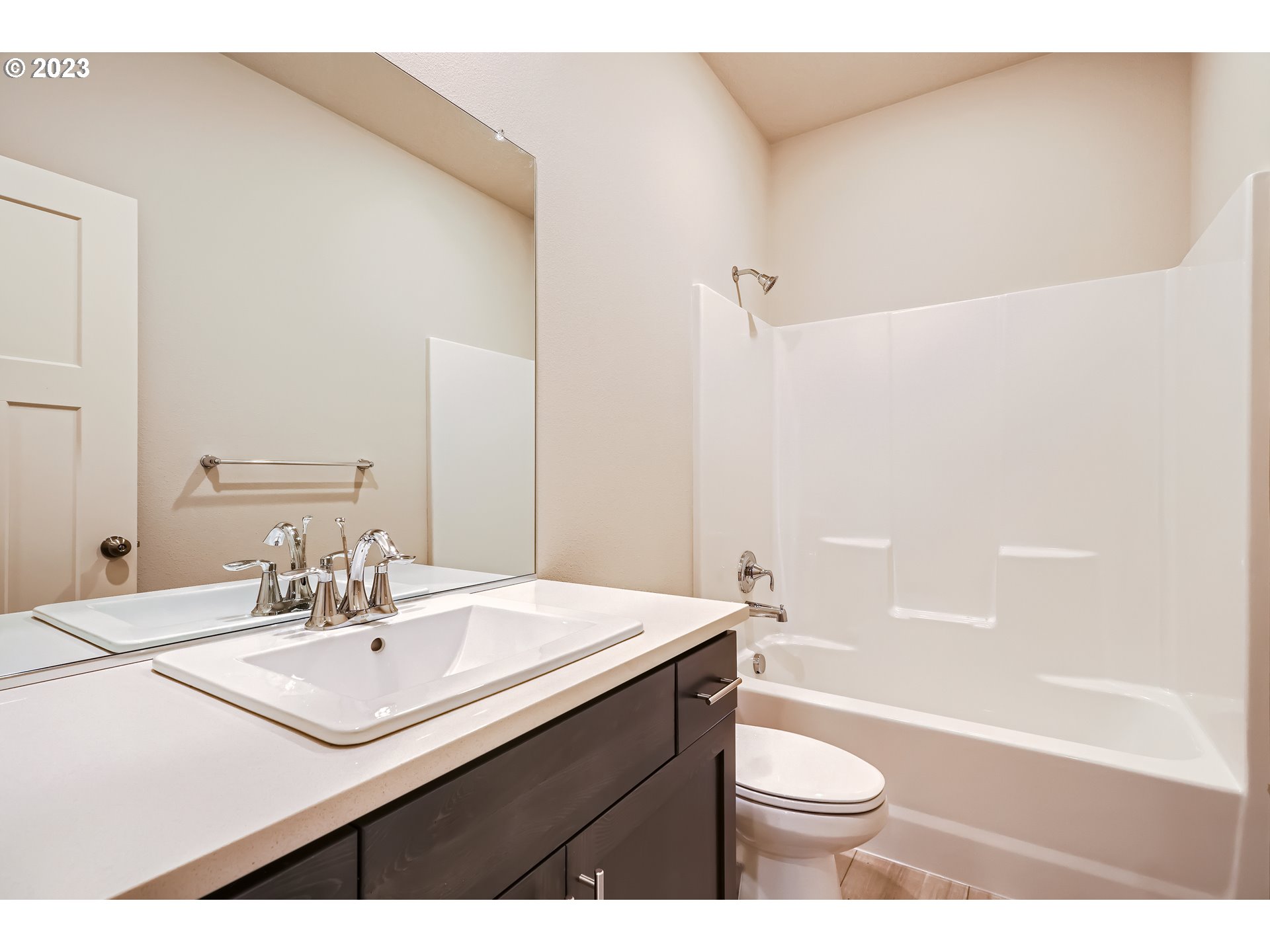 2816 South 7th Circle Ridgefield, WA 98642 - Photo 10 of 25 a bathroom with a sink a toilet a mirror and shower