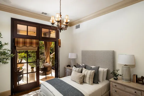 a open kitchen with stainless steel appliances kitchen island granite countertop a table chairs in it and a window
