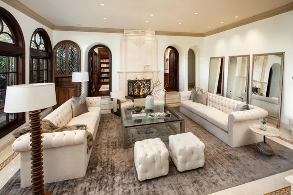 a view of a dining room with furniture chandelier and wooden floor