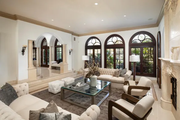 a front view of a house with a large window and dining table