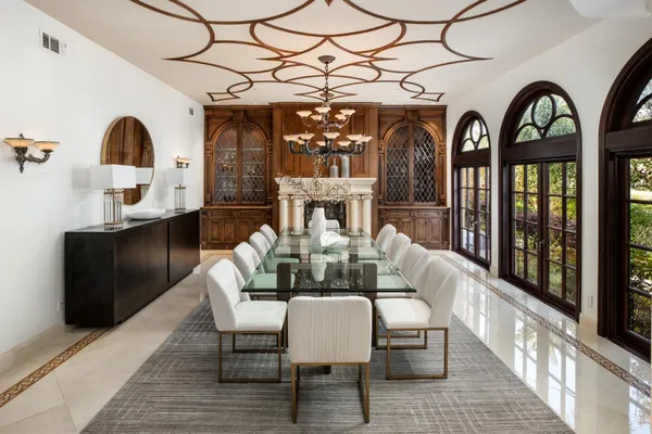 a kitchen with a sink a counter top space and stainless steel appliances