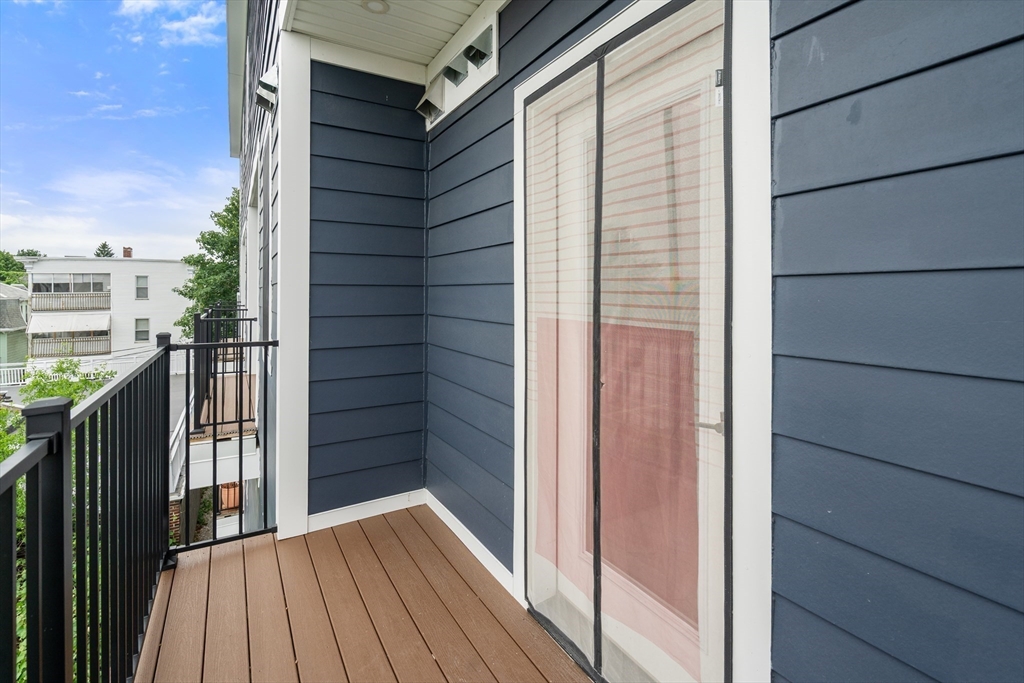 32 Pearl Street, Unit 4 Boston, MA 02125 - Photo 32 of 35 a view of balcony and wooden floor