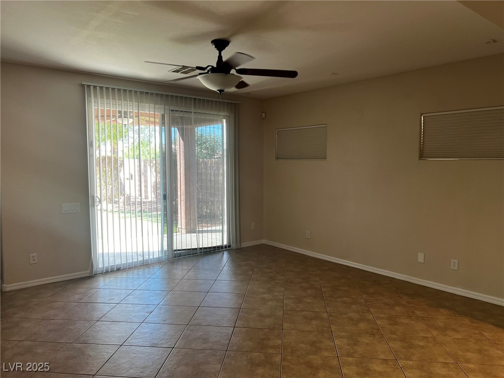 3417 West Birdwatcher Avenue North Las Vegas, NV 89084 - Photo 12 of 28 Spare room with ceiling fan and light tile patterned floors