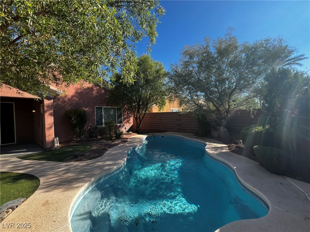 3417 West Birdwatcher Avenue North Las Vegas, NV 89084 - Photo 15 of 28 View of swimming pool with a fenced backyard and a patio