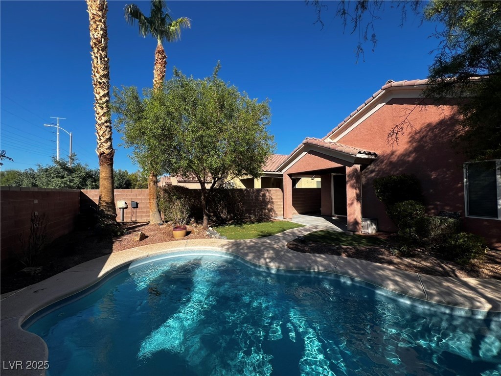 3417 West Birdwatcher Avenue North Las Vegas, NV 89084 - Photo 16 of 28 View of swimming pool with a fenced backyard