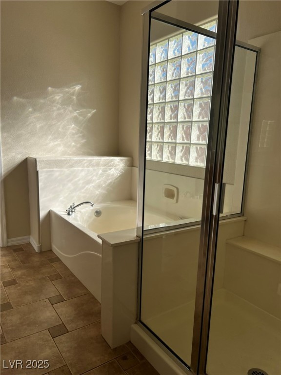 3417 West Birdwatcher Avenue North Las Vegas, NV 89084 - Photo 19 of 28 Bathroom featuring a bath and a shower stall