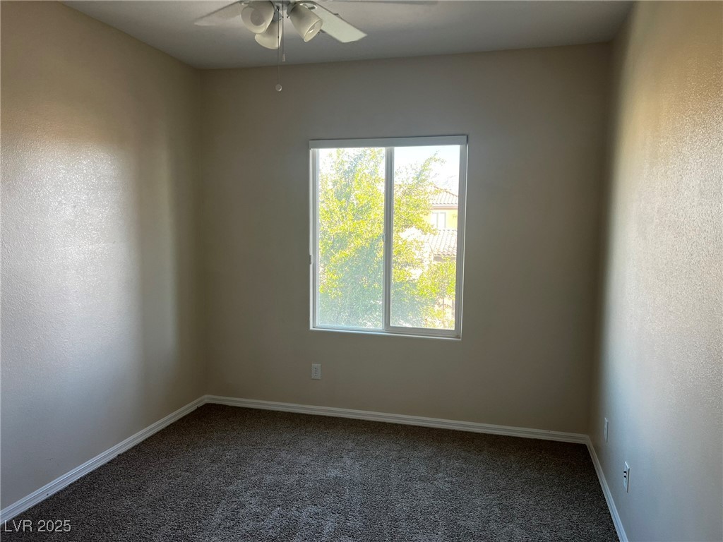 3417 West Birdwatcher Avenue North Las Vegas, NV 89084 - Photo 24 of 28 Carpeted spare room featuring a textured wall and a ceiling fan