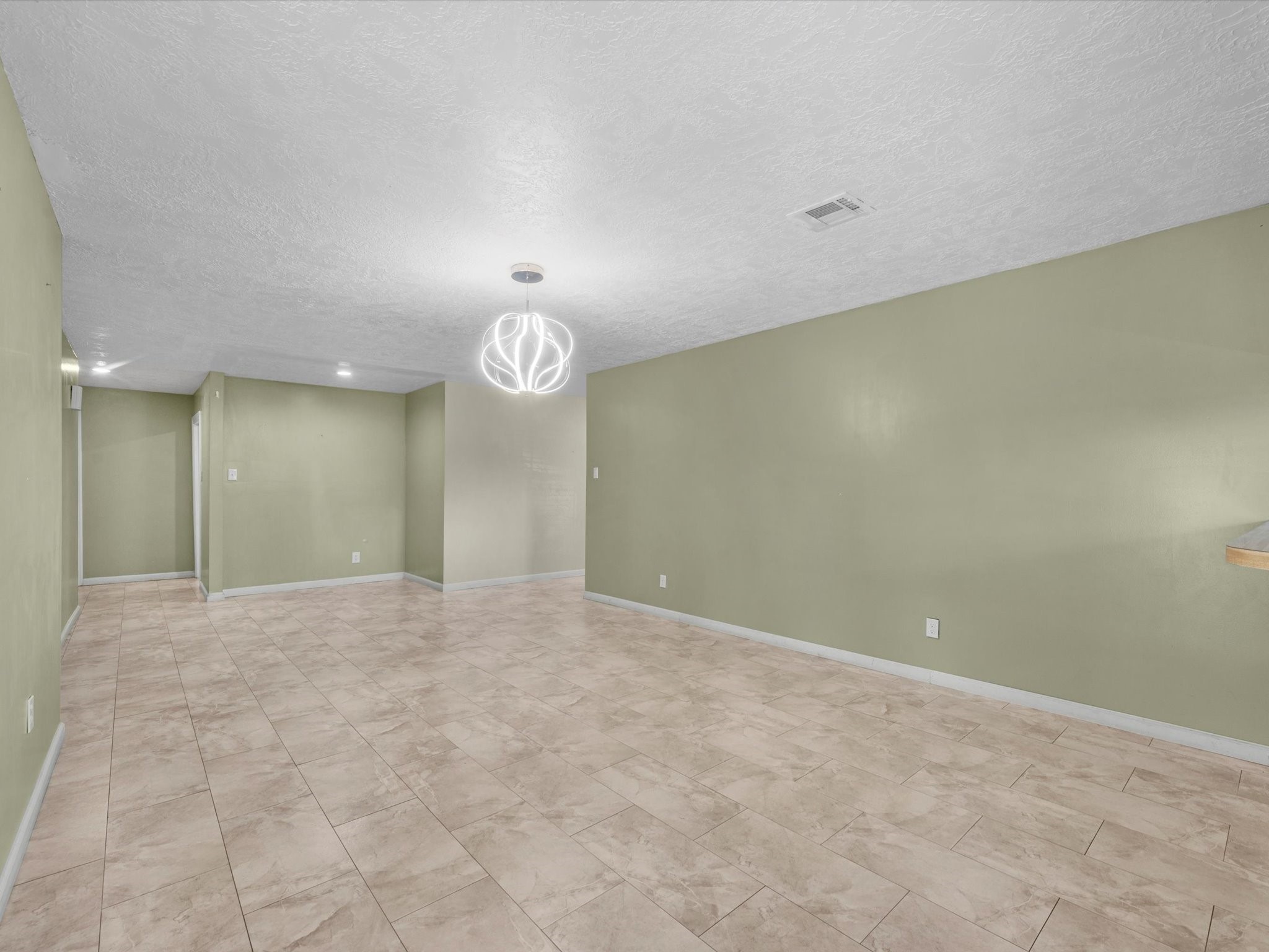 4318 Ponca Street Pasadena, TX 77504 - Photo 3 of 22 an empty room with a empty space and a window