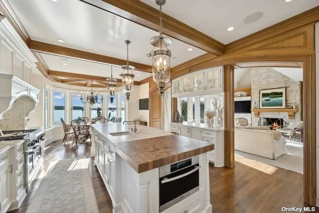 a open kitchen with stainless steel appliances granite countertop a stove and refrigerator