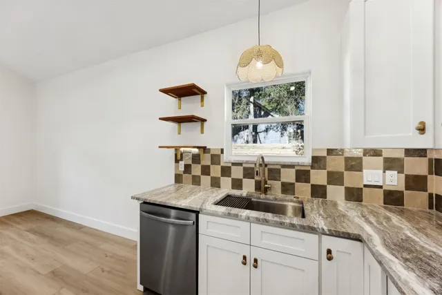 a kitchen with a sink and a window