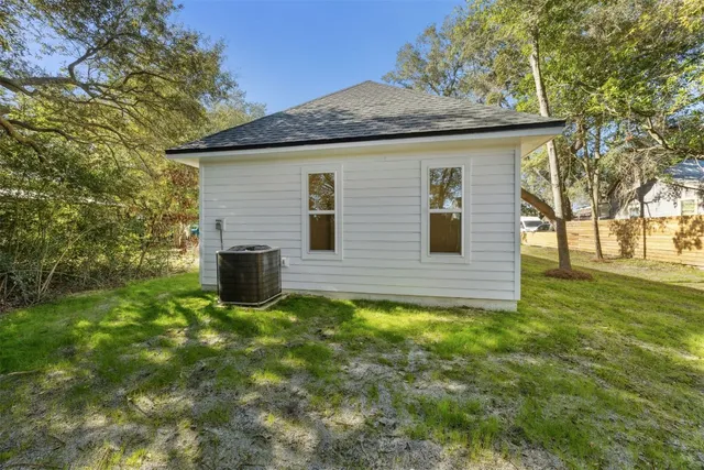 a view of a backyard of the house