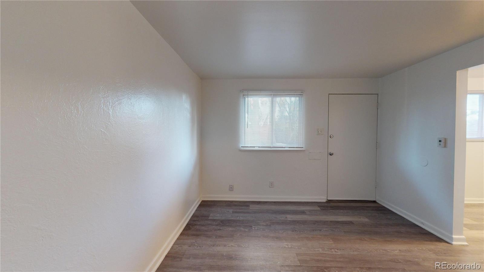 1251 Upham Street, Unit 8 Lakewood, CO 80214 - Photo 11 of 38 a view of empty room with window