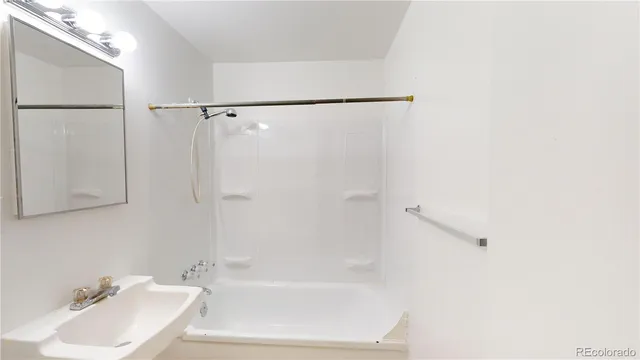 a bathroom with a sink and a shower