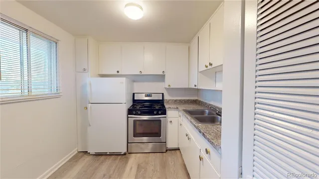 a kitchen with a stove microwave and refrigerator
