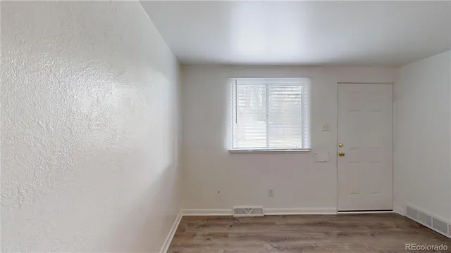 a view of a room that has a window in it