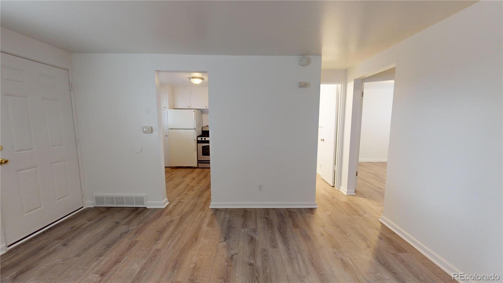 1251 Upham Street, Unit 8 Lakewood, CO 80214 - Photo 24 of 38 wooden floor in an empty room with a window