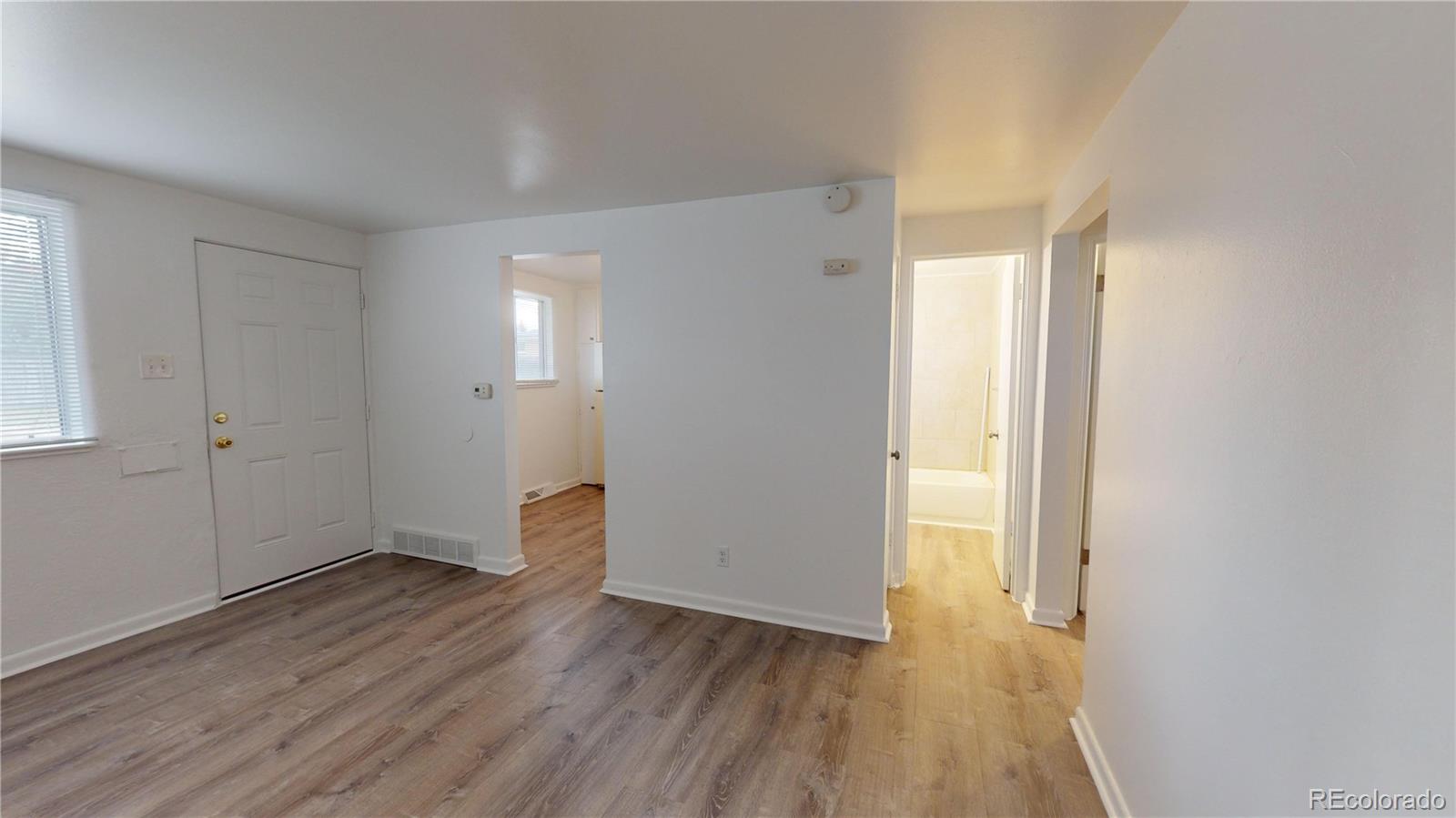 1251 Upham Street, Unit 8 Lakewood, CO 80214 - Photo 26 of 38 wooden floor in an empty room